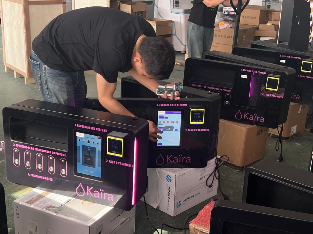 Wehoo Vending testing a perfume vending machine before shipment